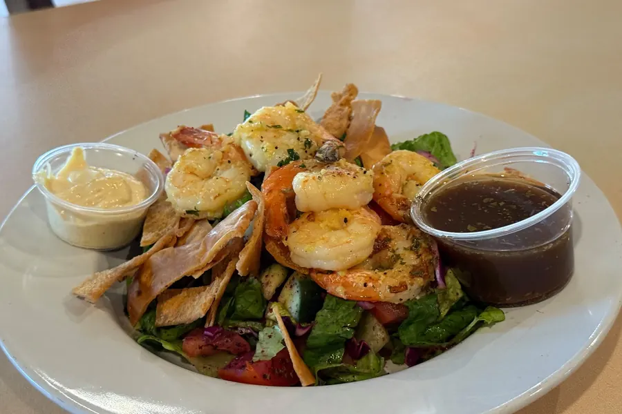 Shrimp fattoush salad with two sauce cups